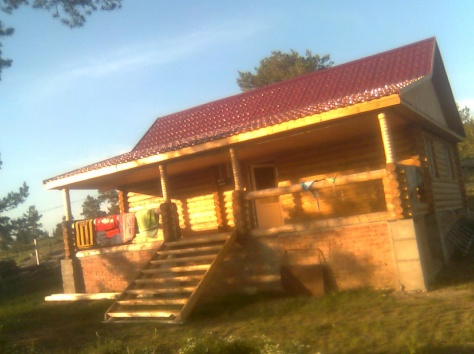 Продам продается новый дом с баней из оцилиндрованных бревен, фотография 1