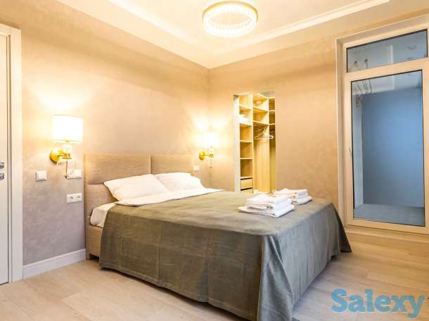 Комфортные апартаменты в центре города, Ул. Навои 9/1, фотография 1