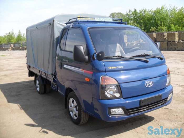 Водитель на своем грузовом авто, фотография 1